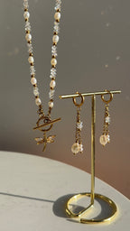 Aurelia Earrings styled on jewellery stand alongside the Aurelia Necklace