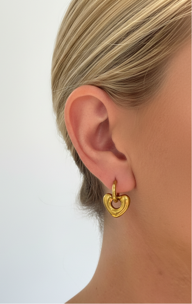 Golden Heart Huggie Earring - On Ear Clean Background