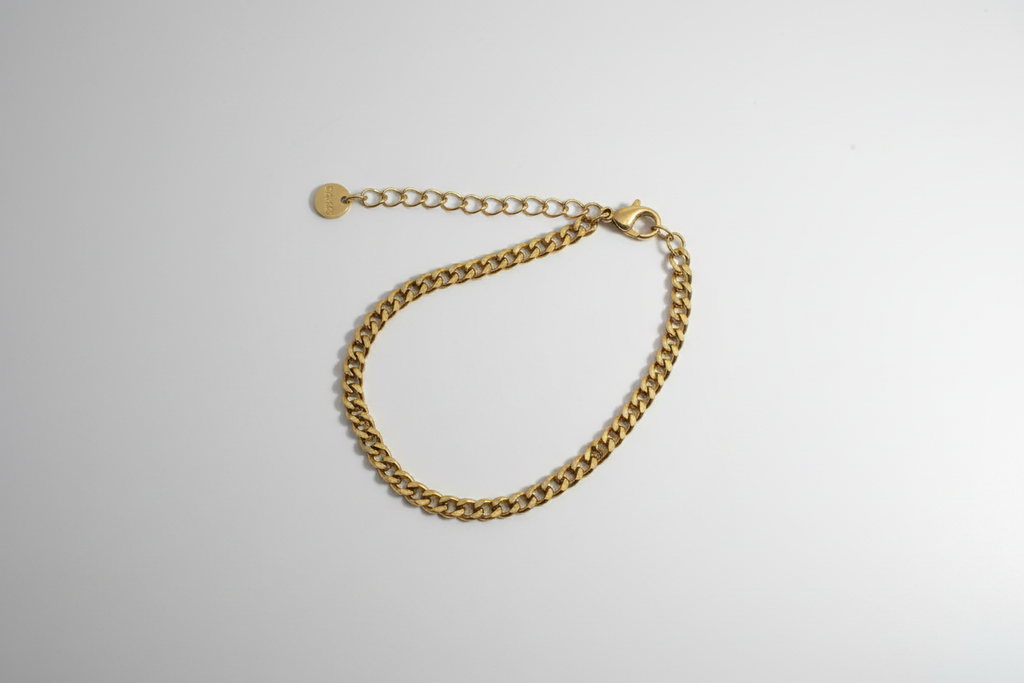 Curb Chain Bracelet - Gold curb chain bracelet with lobster clasp overhead view