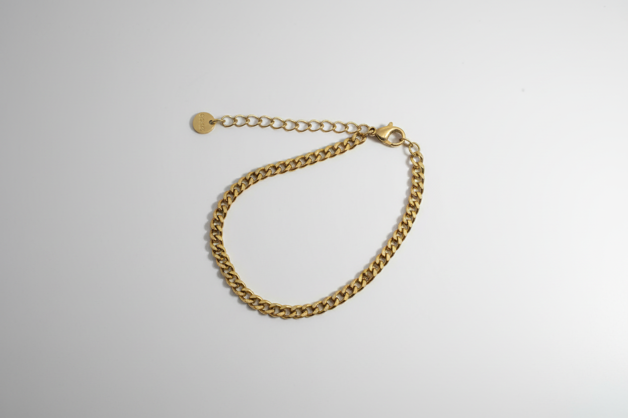 Curb Chain Bracelet - Gold curb chain bracelet with lobster clasp overhead view
